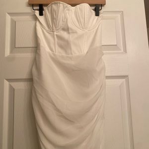 White mini strapless dress with corset top.